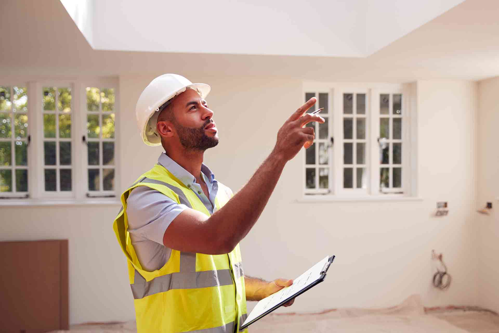 Third Party Wall Surveyors Sunderland reviewing plans between two parties during a dispute